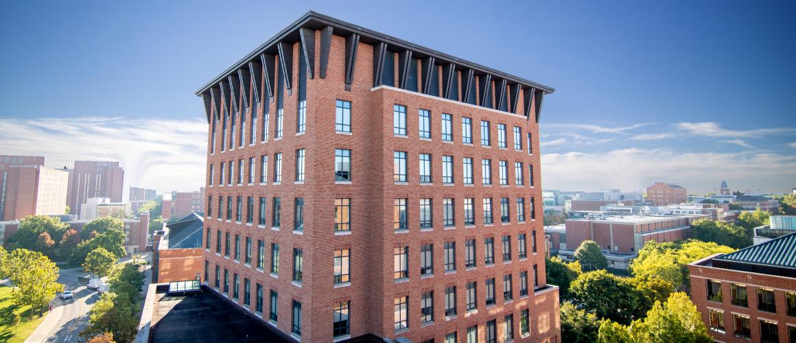 Fisher Hall against a blue sky.