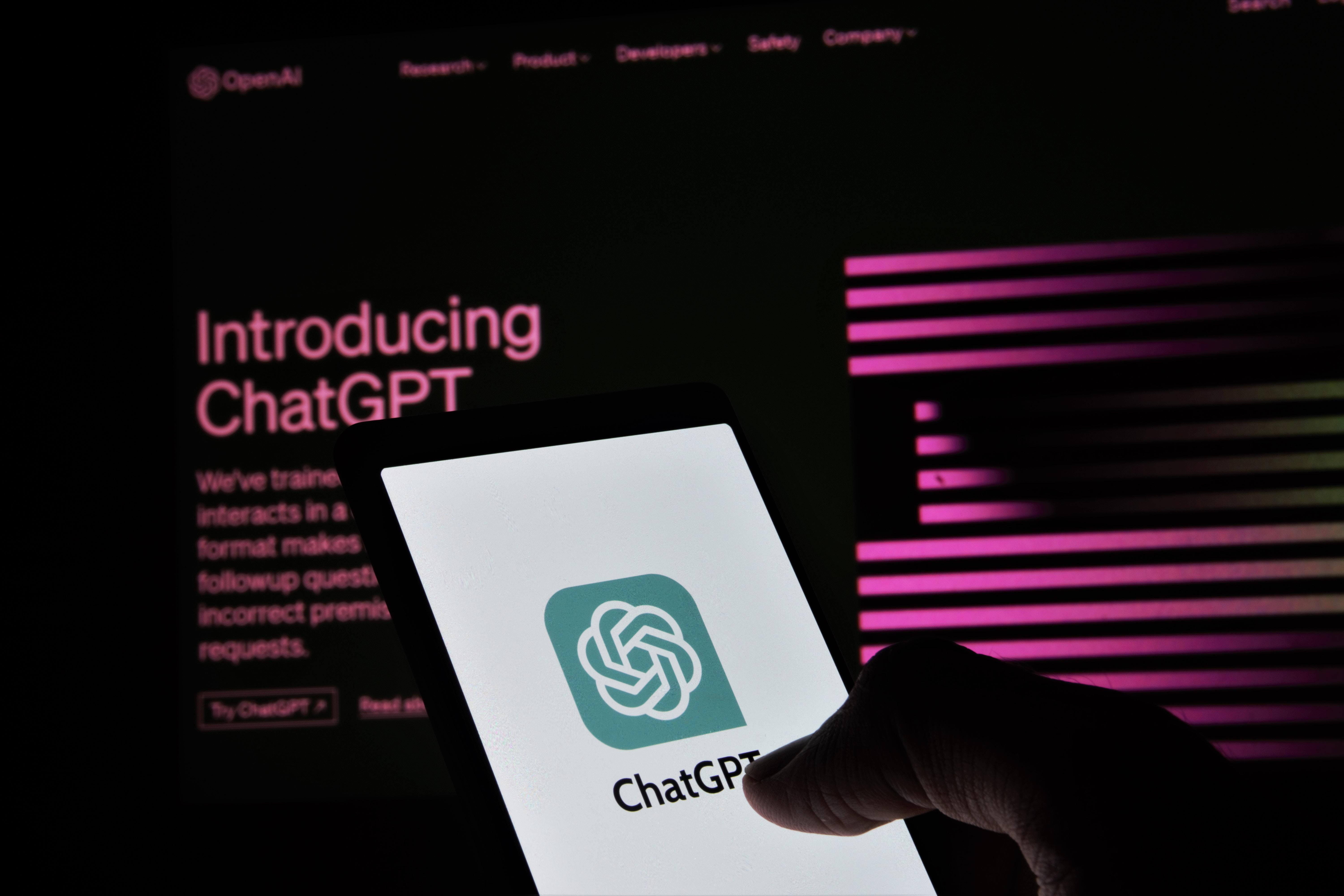 Hand hovers over ChatGPT icon on phone screen