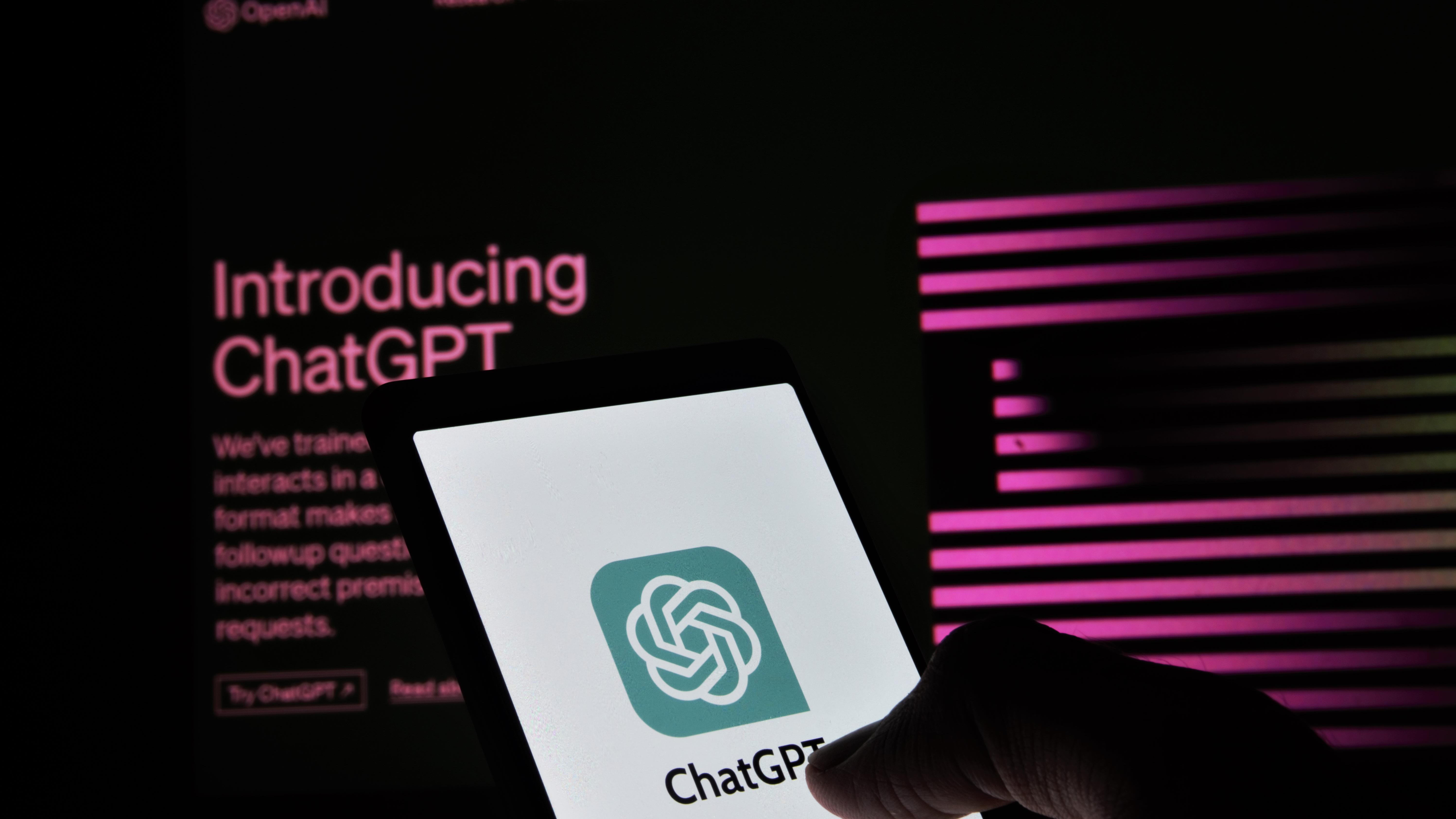 Hand hovers over ChatGPT icon on phone screen