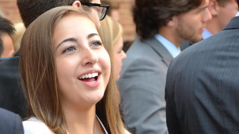 an undergraduate student greeting a recruiter
