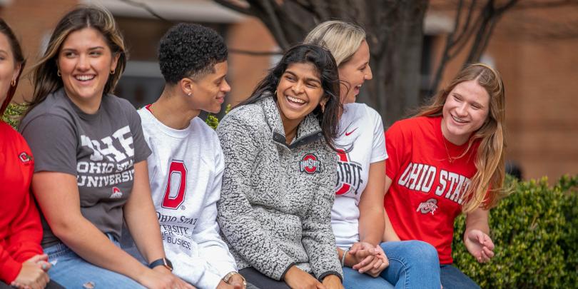Group of students wearing Ohio State gear and smiling