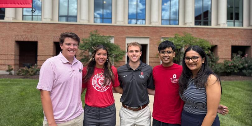 Five Career Coaches standing in front of Gerlach Hall and smiling