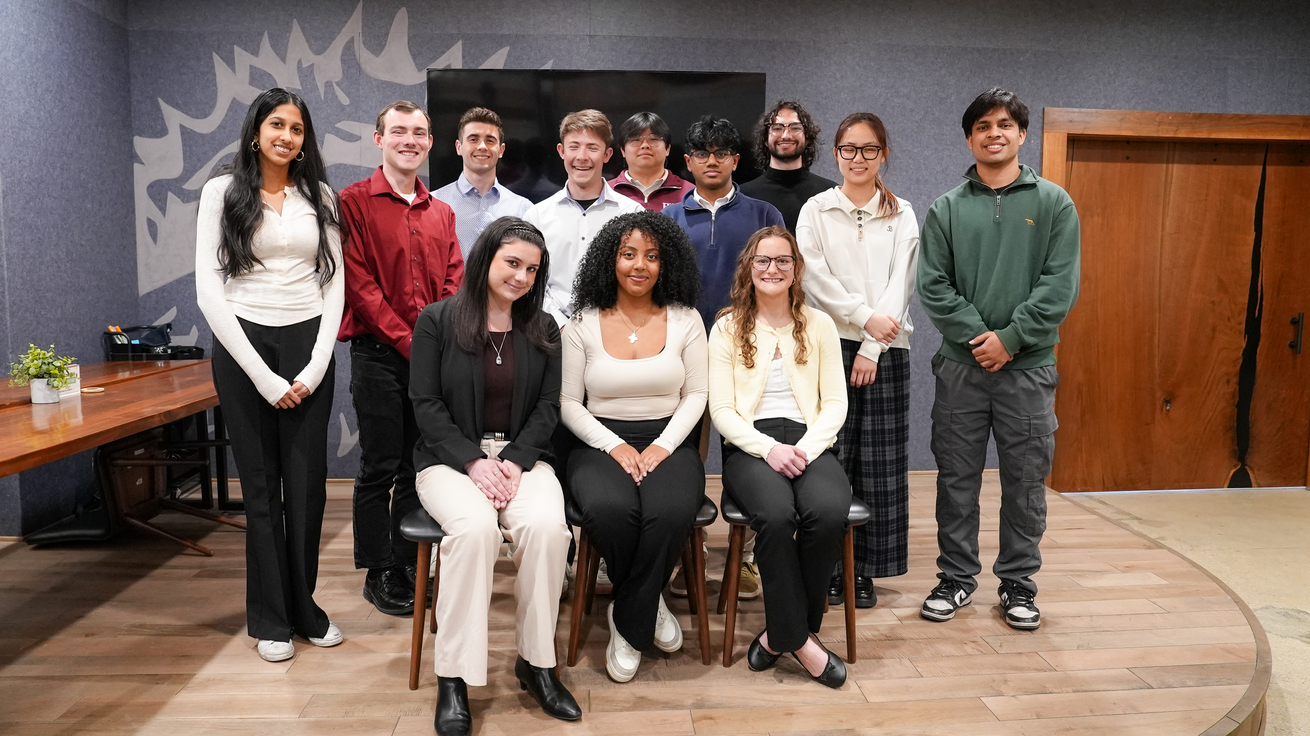 Group of students after sustainability presentation