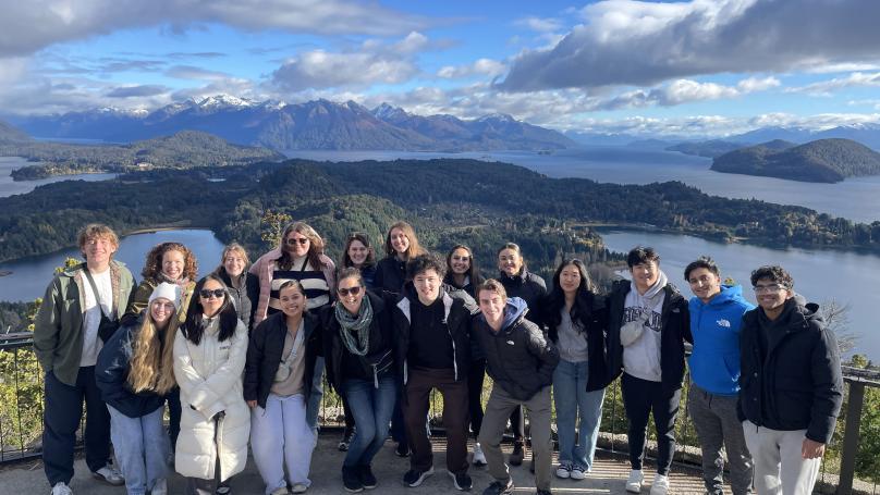 Global consulting students posing on mountain top