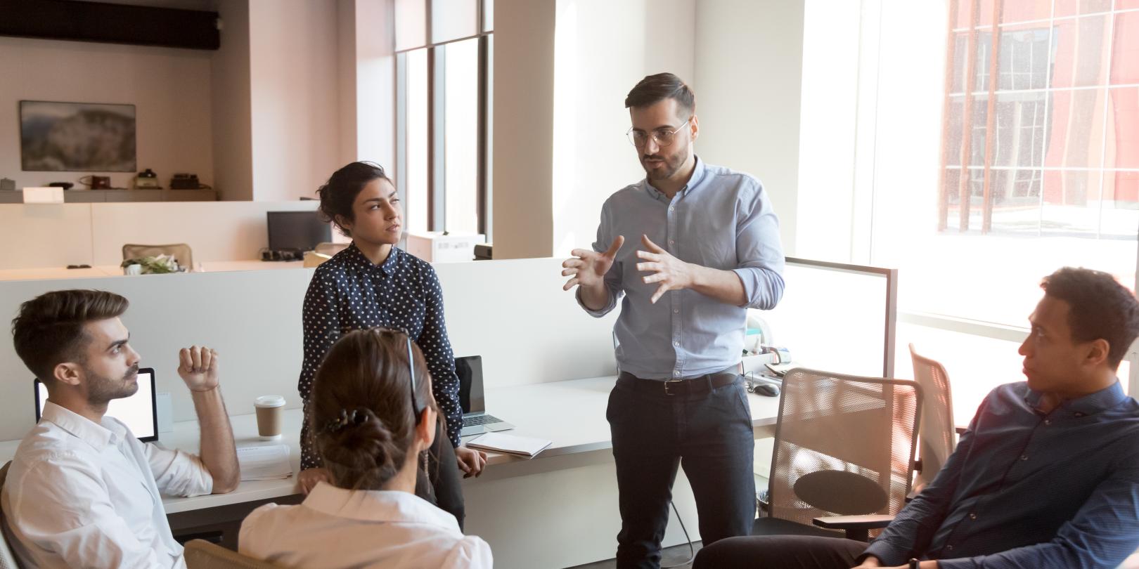 5 people in a business meeting