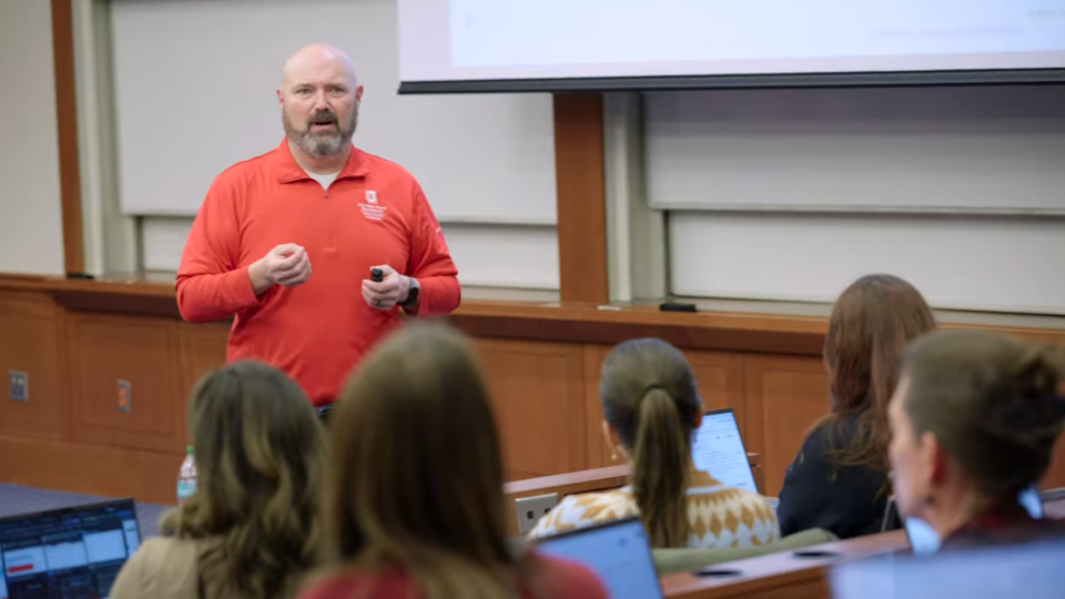 Jim Perry teaching a classroom of Fisher staff about Copilot