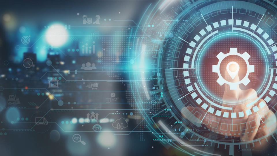 A finger tapping a technology graphic with a gear in the center