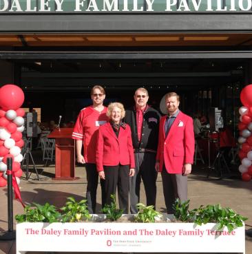 The Daley family in front of the Daley Family Terrace and Pavilion