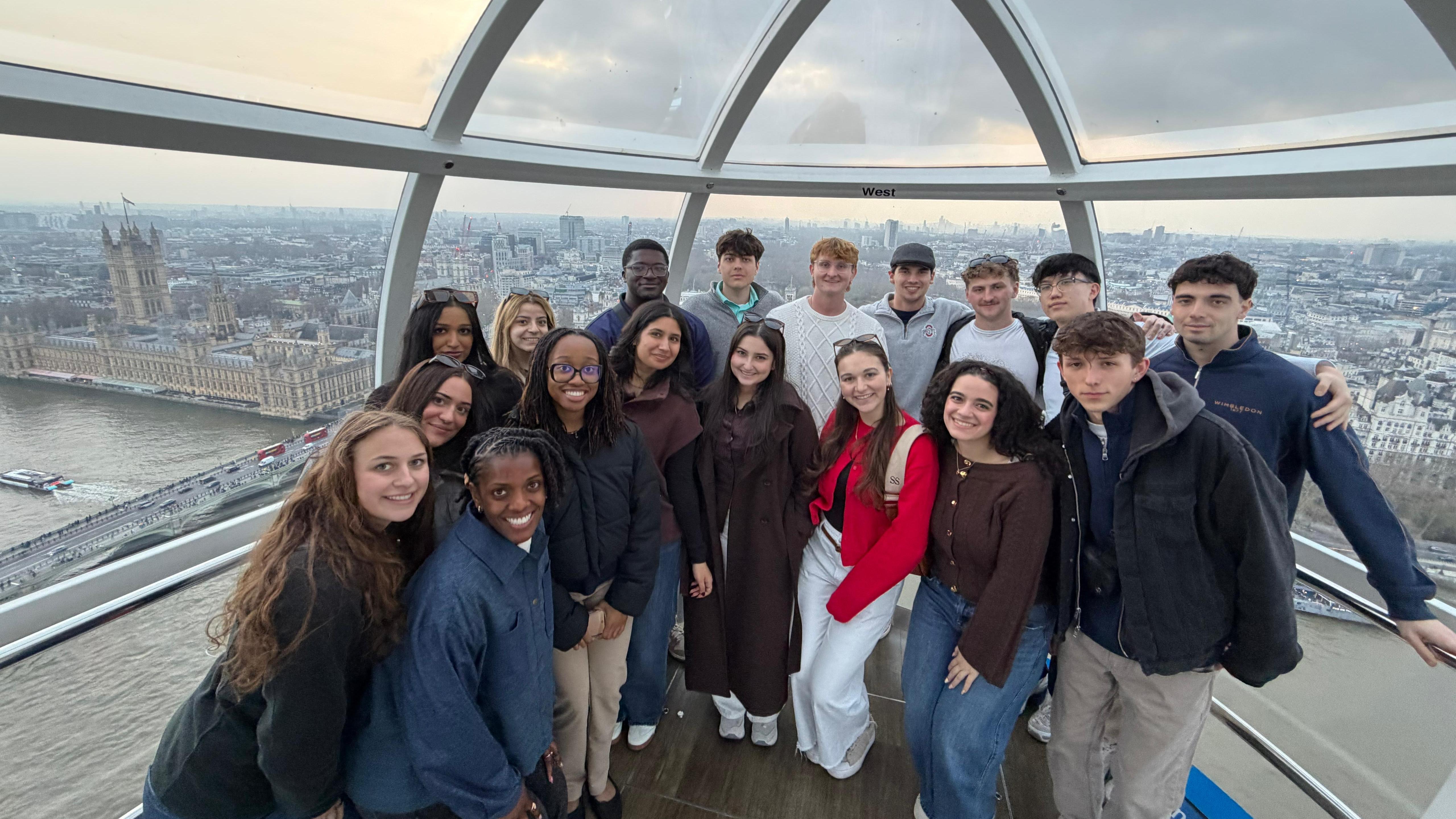 Group of students on the London Eye with London city views in the background
