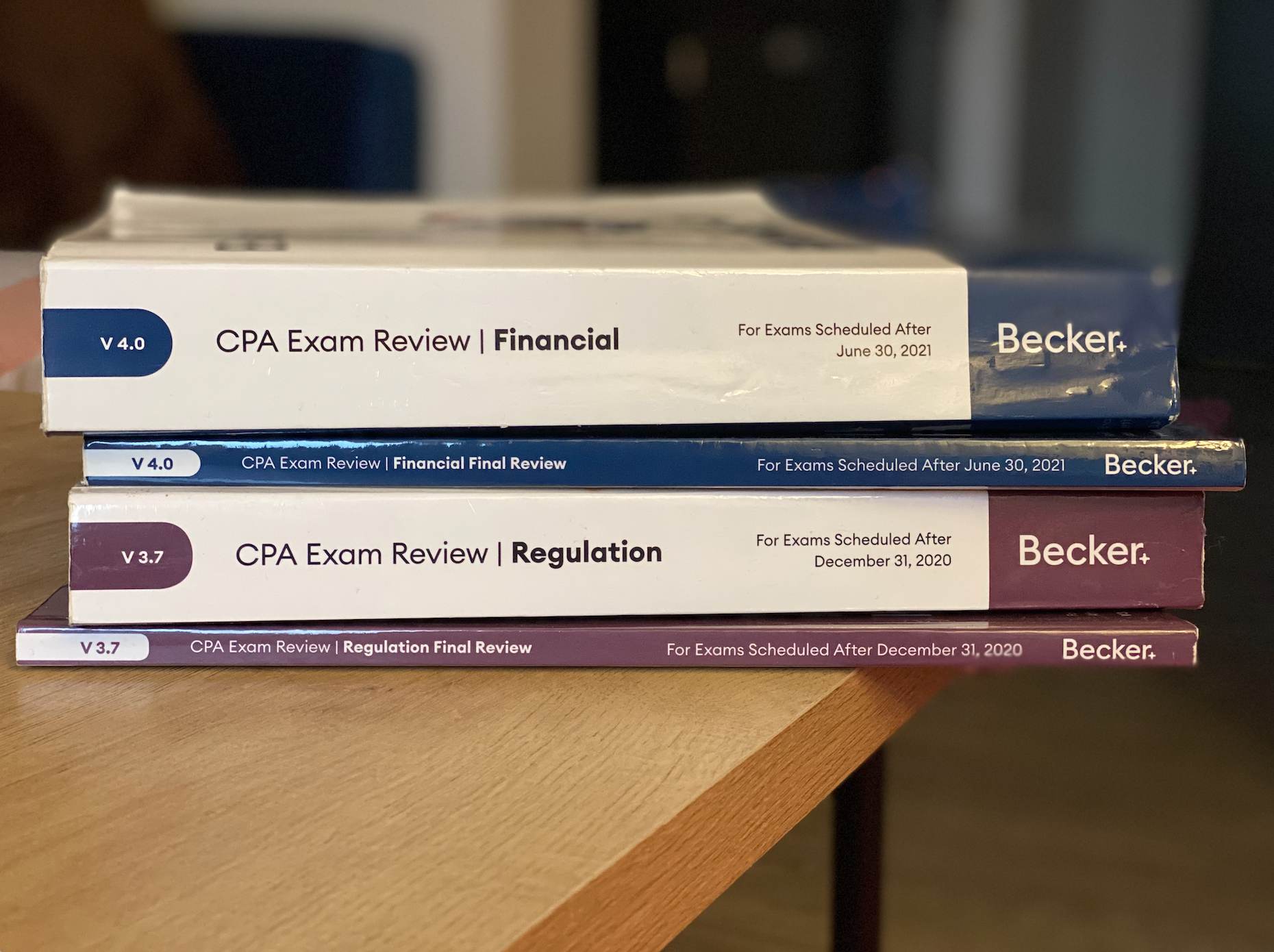 FAR and REG Becker textbooks on table