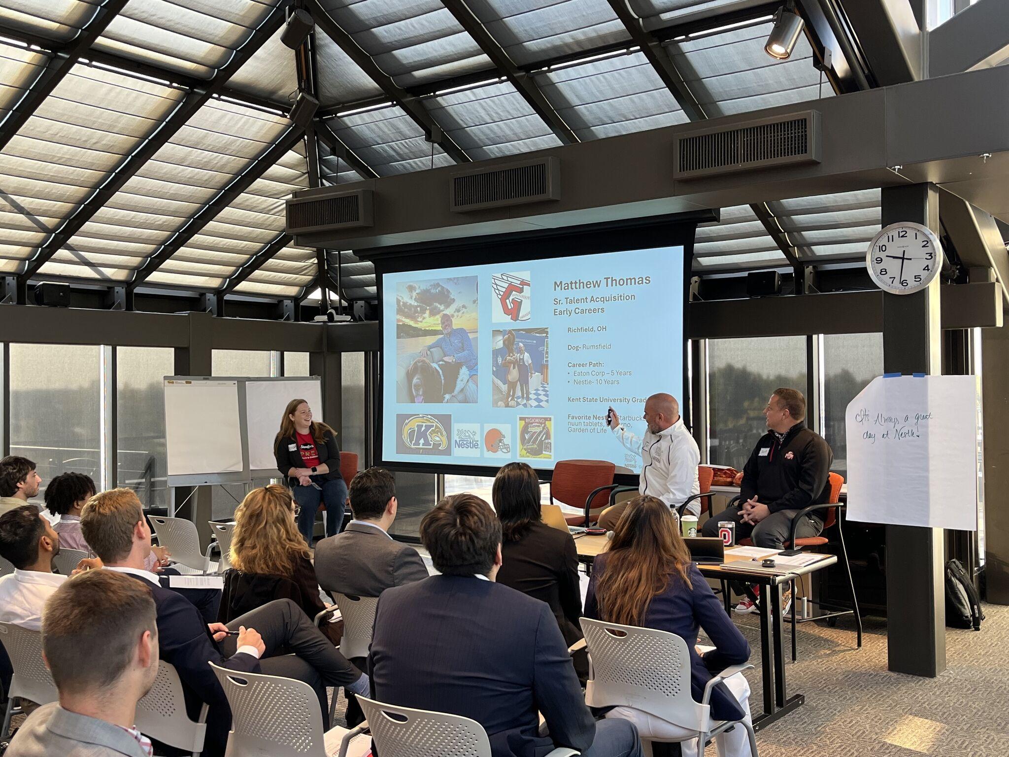 Fisher MBA students listening attentively during a Nestlé executive info session