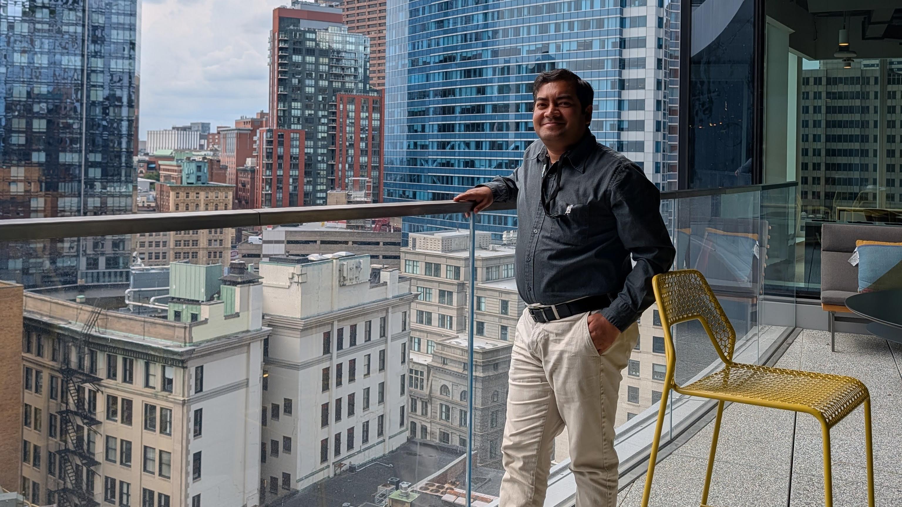 Standing on the edge of a builing and admiring the Boston Skyline from the office