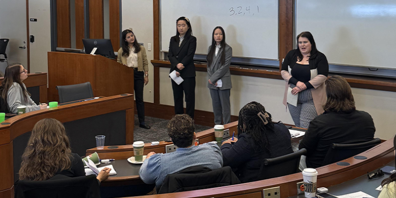 Students Presenting at the MHRM Case Competition in a classroom at Fisher College of Business