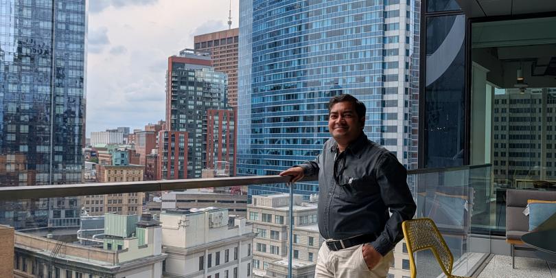 Standing on the edge of a builing and admiring the Boston Skyline from the office