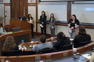 Students Presenting at the MHRM Case Competition in a classroom at Fisher College of Business