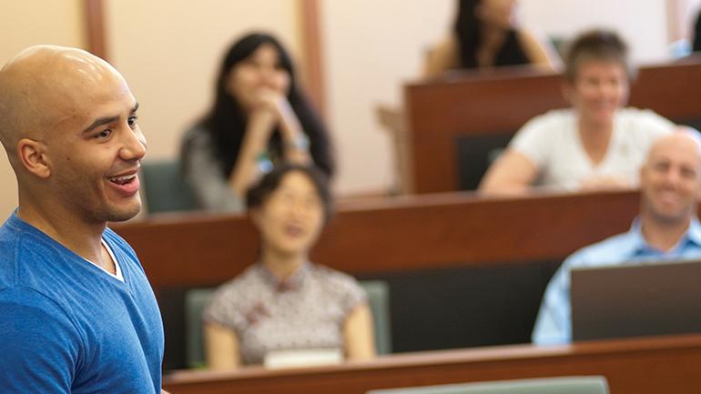 A full-time student presenting to class