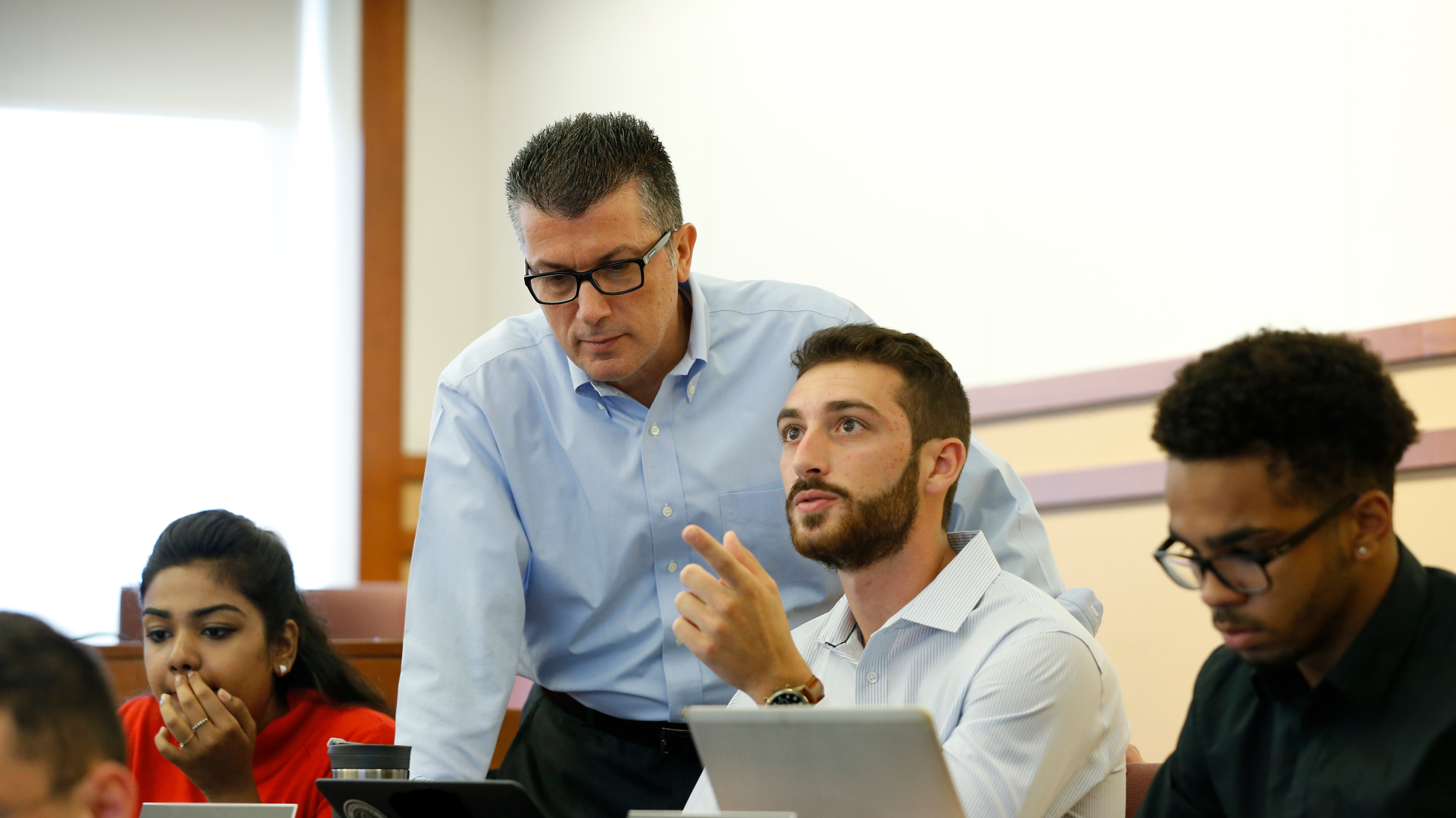 Three students with their professor