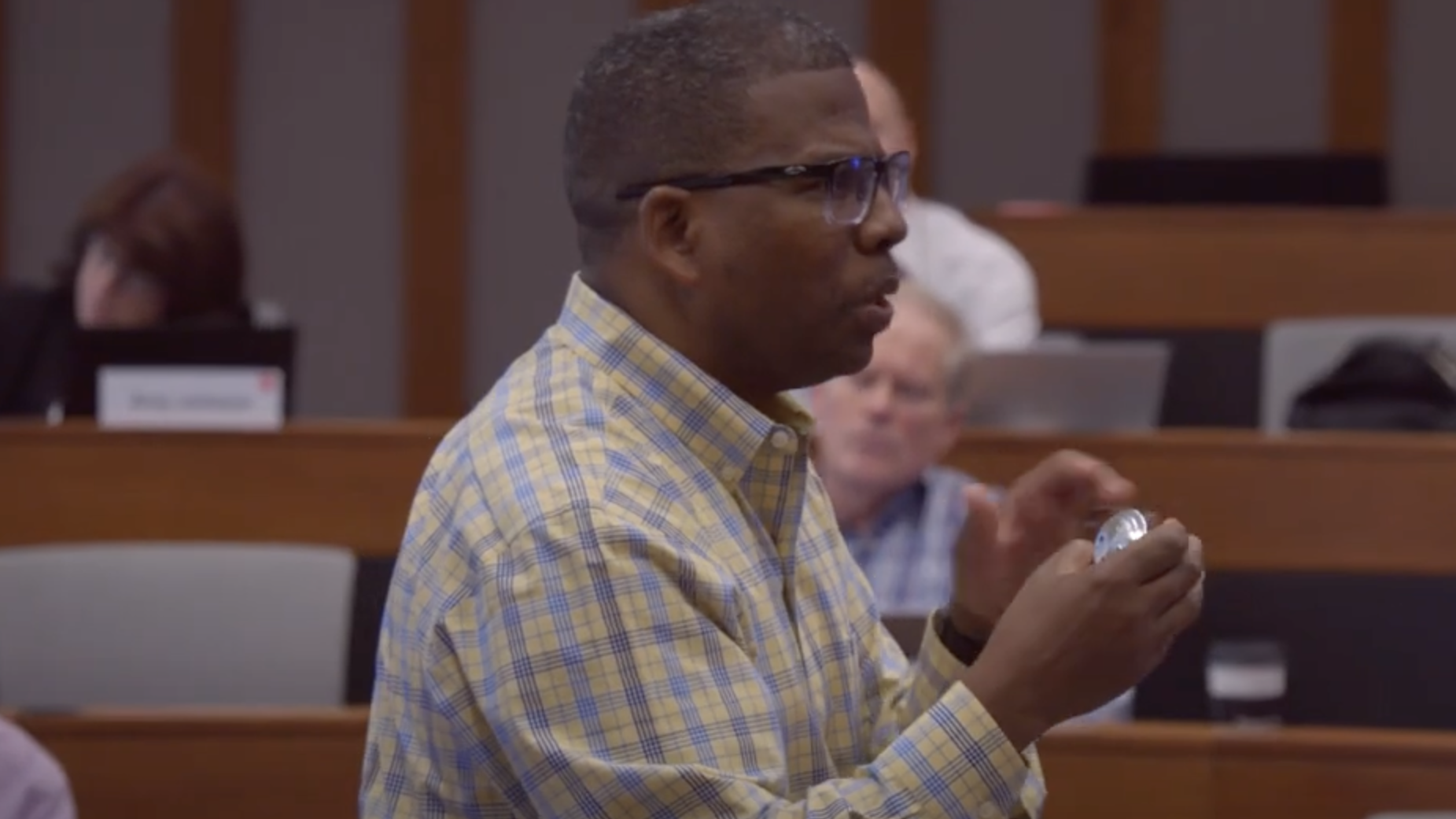 Professor James Hill standing in a classroom