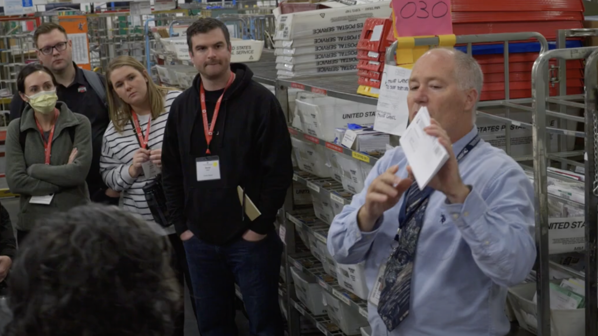 Students touring a USPS sorting facility