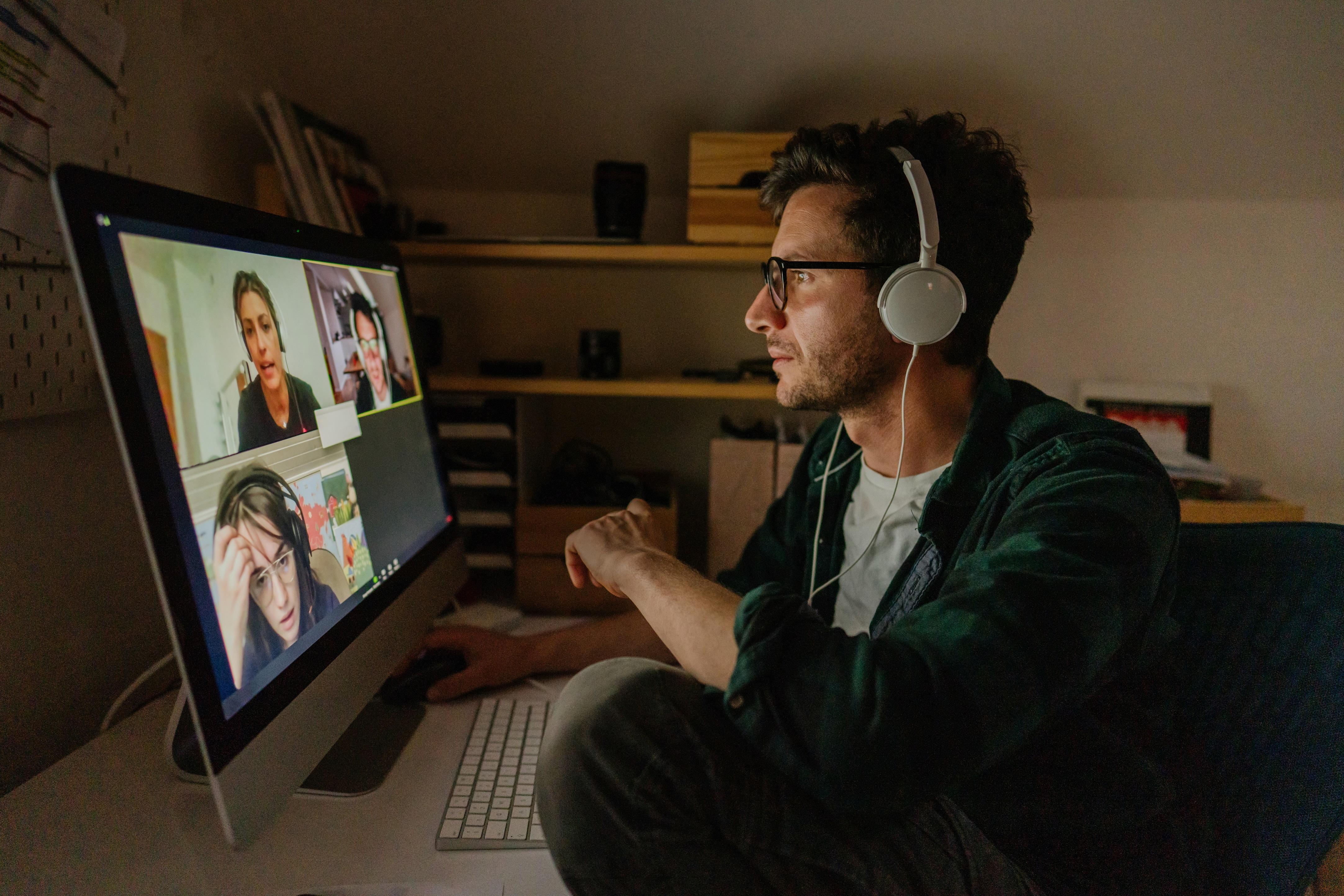 Man looking at video call on computer screen