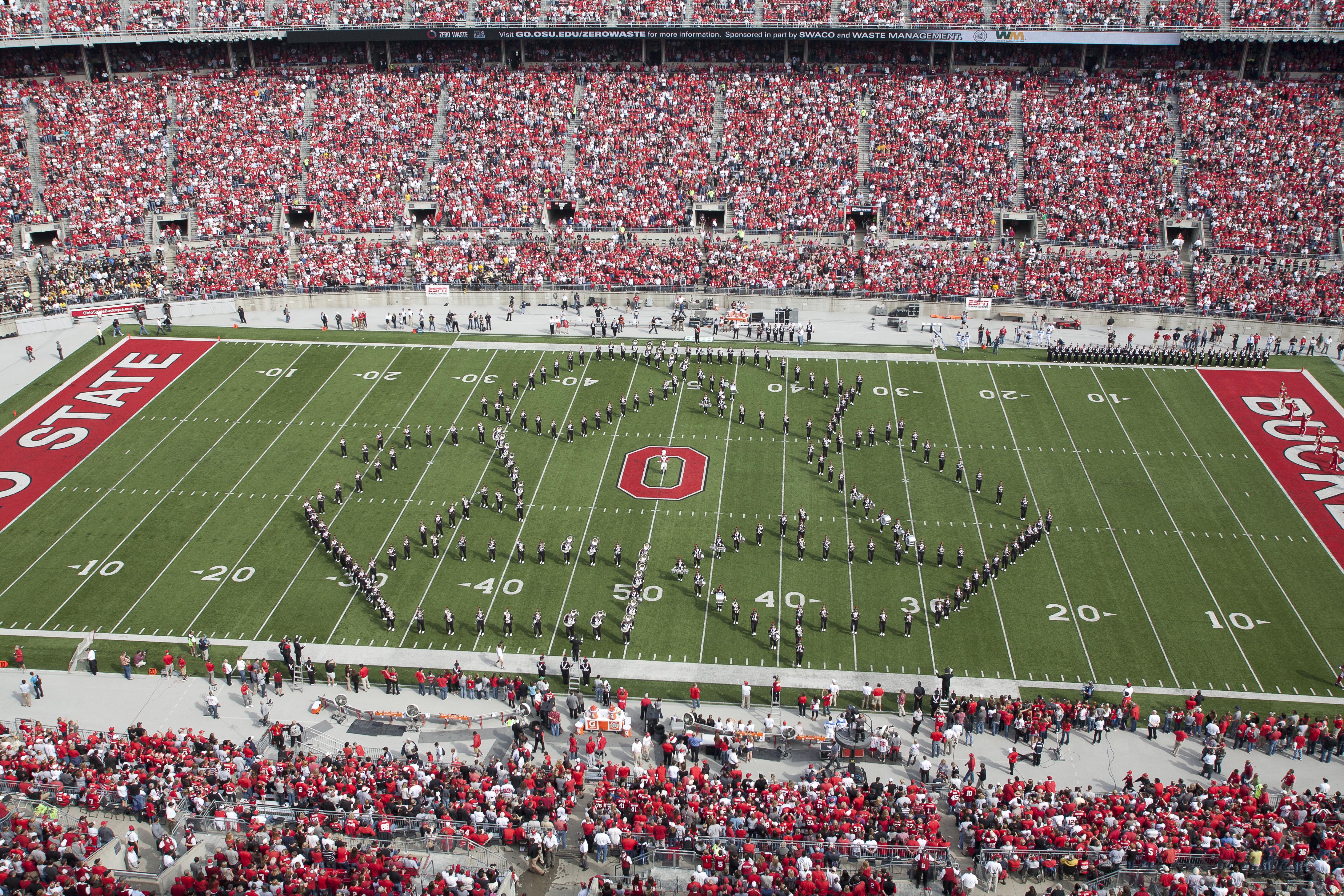 Ohio State Marching Band at Ohio Stadium Making Recycle Emblem
