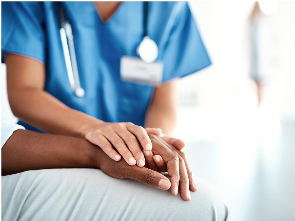 Female nurse helping someone 