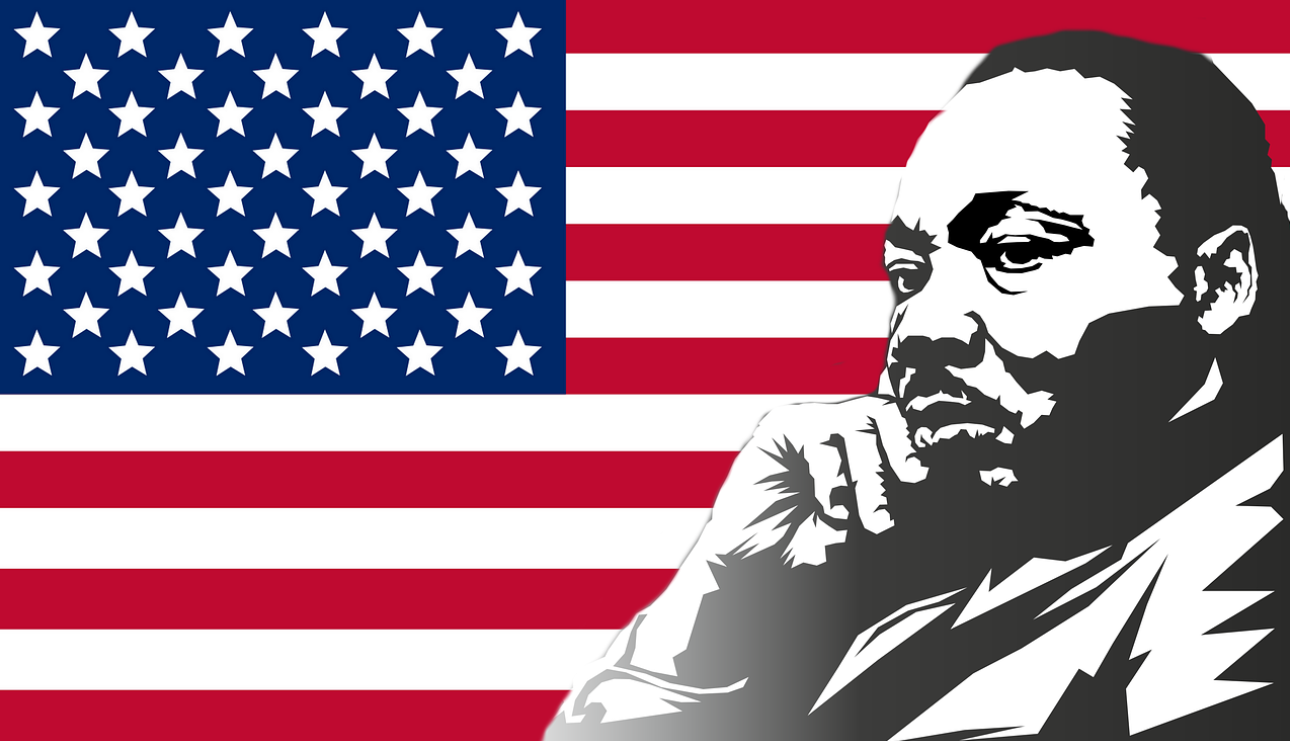 Martin Luther King, Jr. in front of American flag