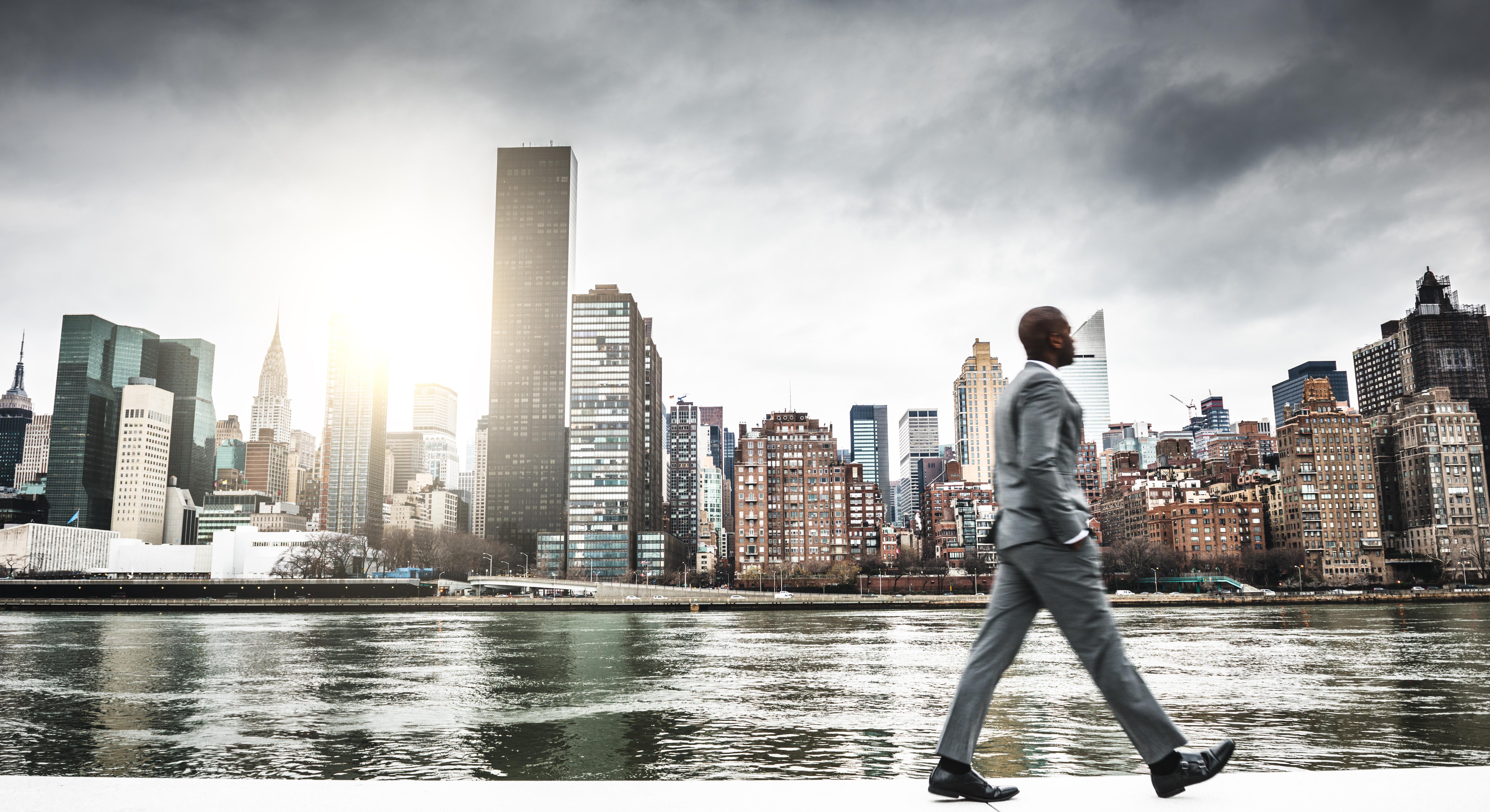 Successful business man looking away against the skyline stock photo