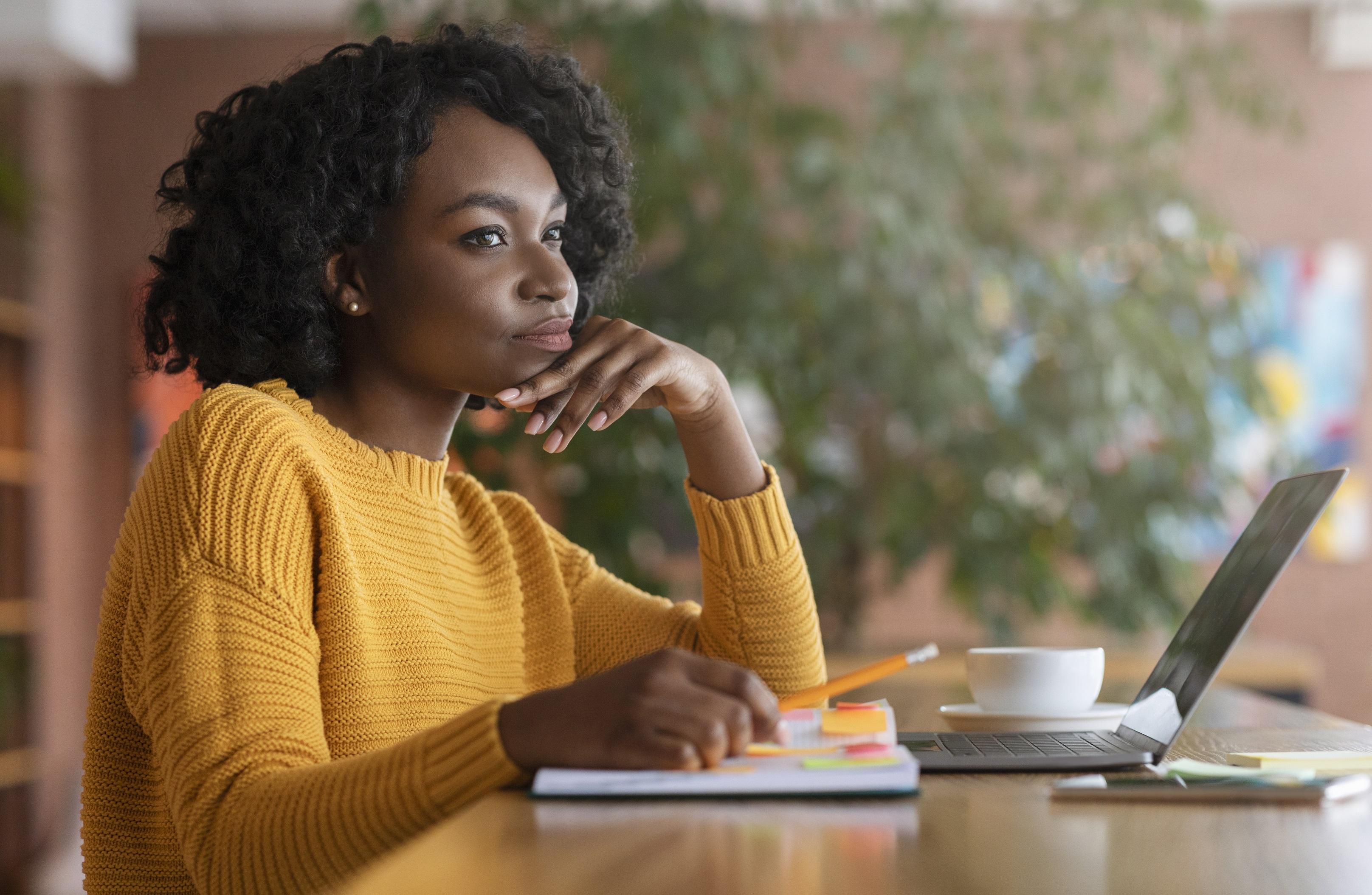 African-American woman looking thoughtful 