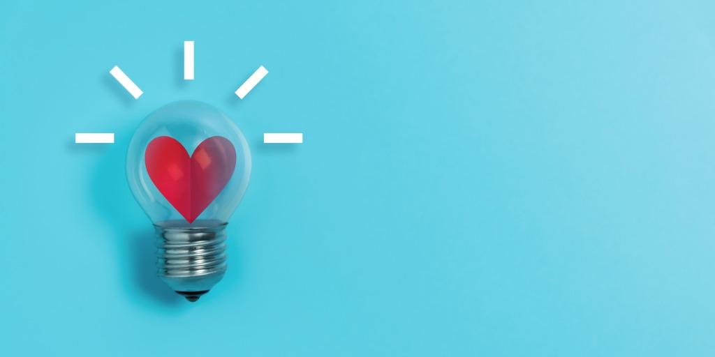 glowing heart inside lightbulb