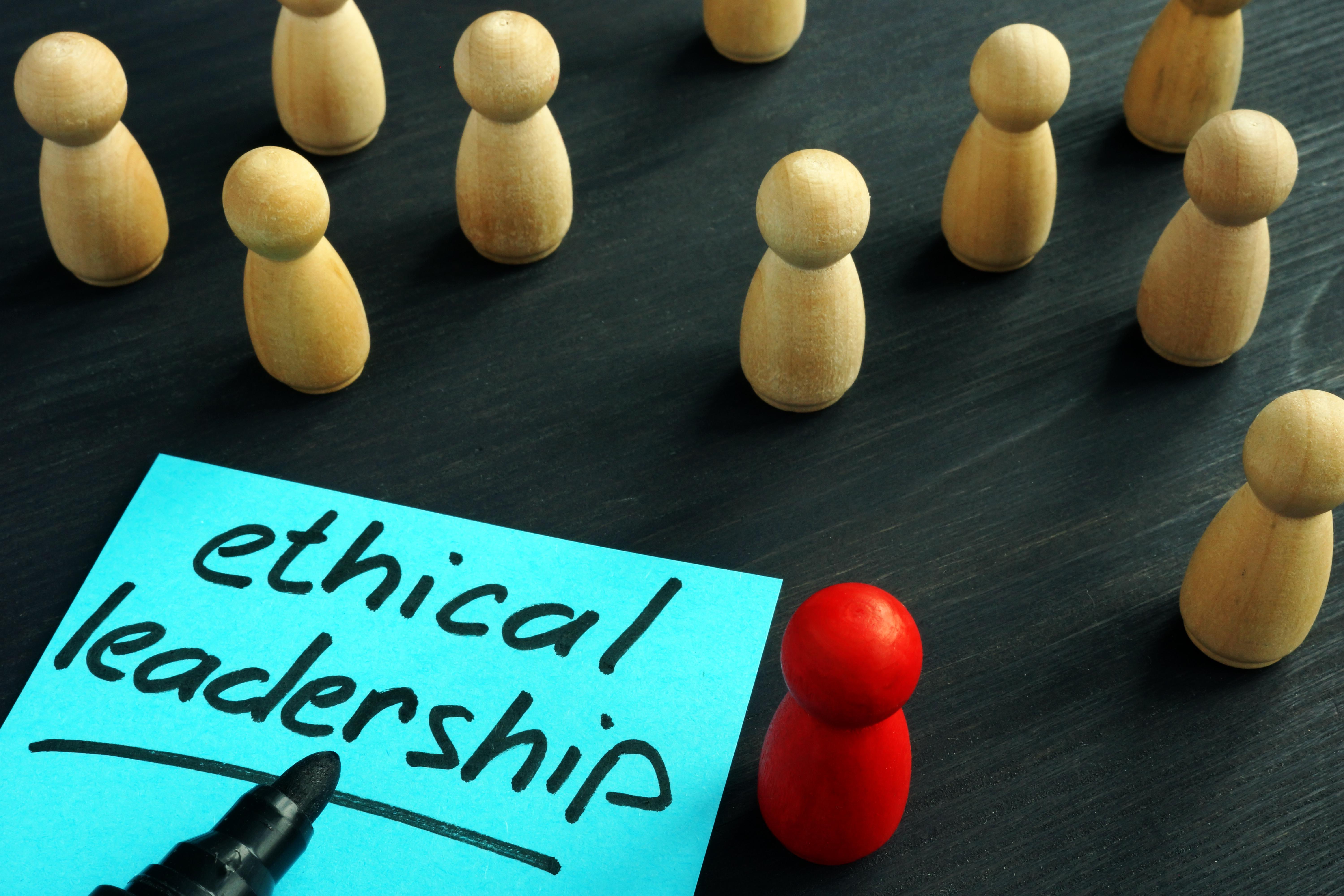 The words "ethical leadership" next to small wooden figures