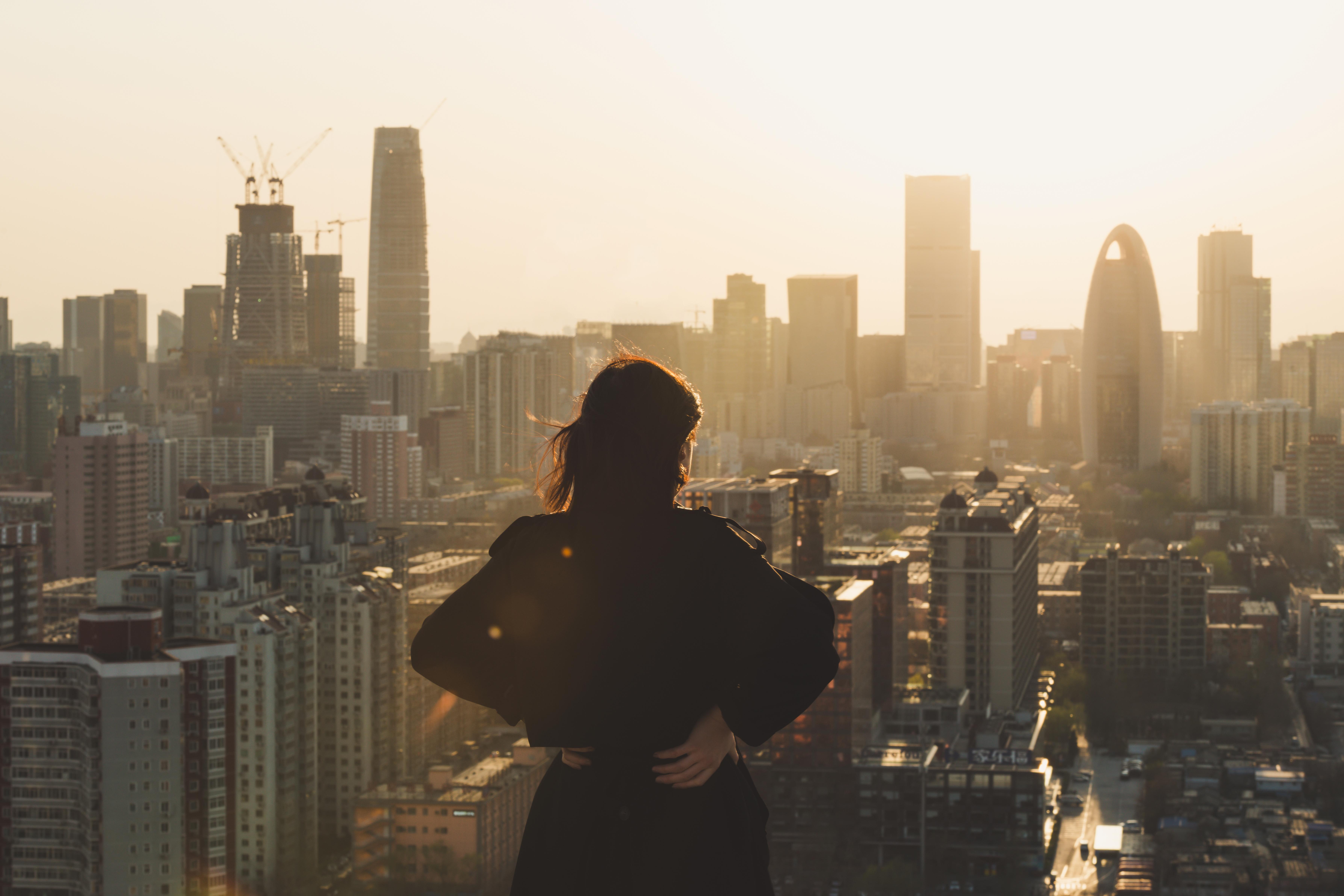 Woman alone looking out over the city