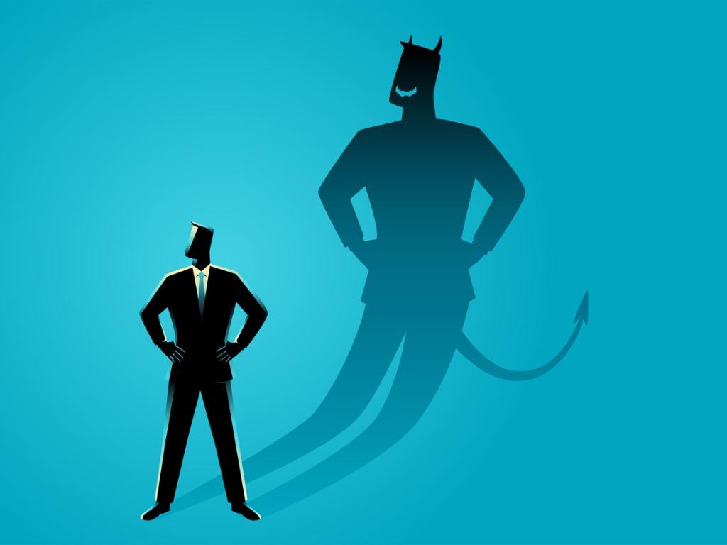 Illustration of businessman with a "devil" shadow 
