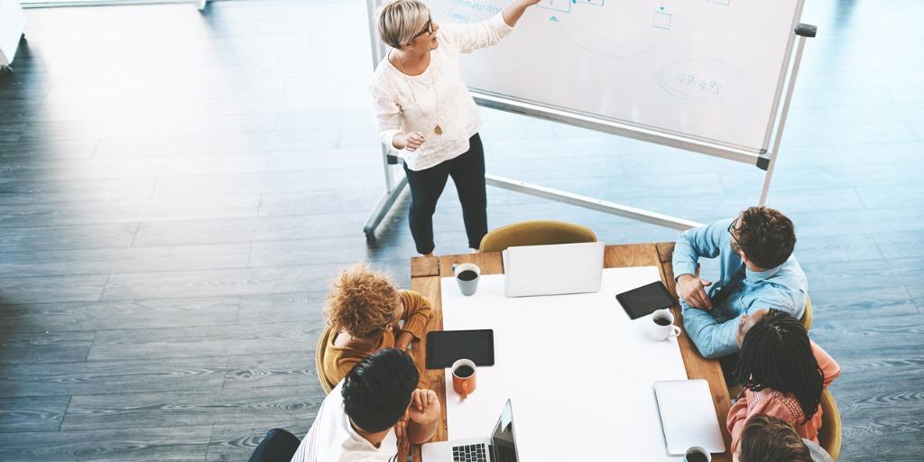 team discussing and implementing a strategic plan