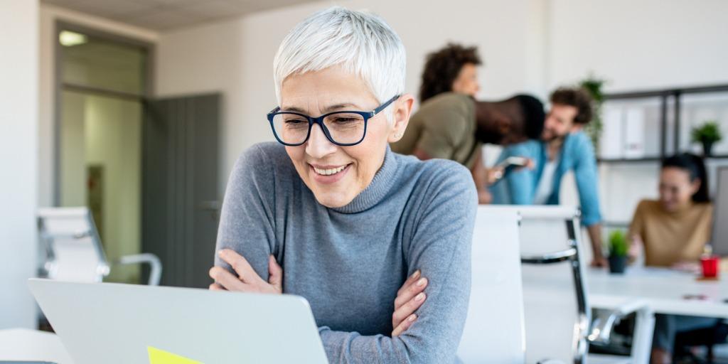 Woman with gray hair in the workplace