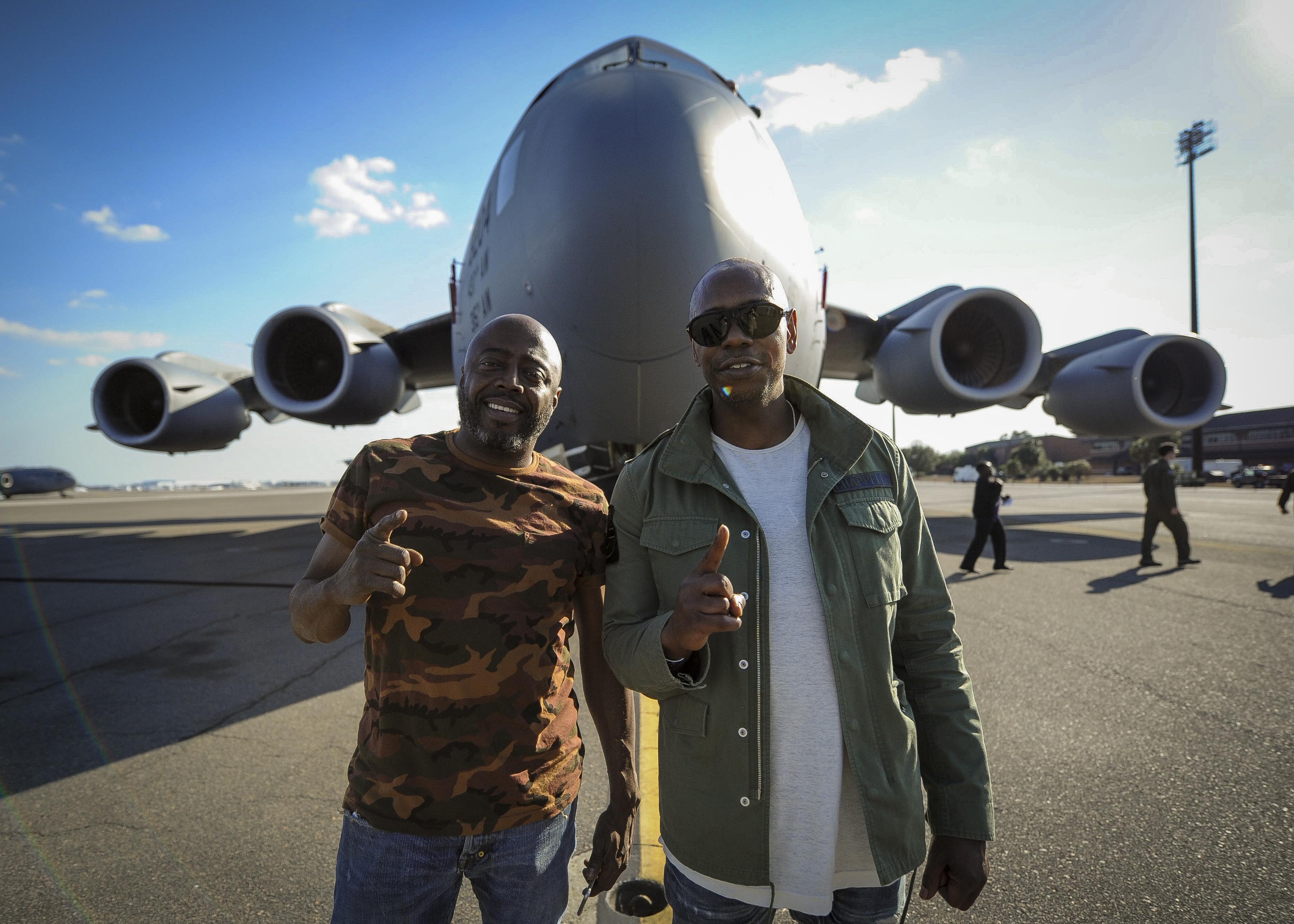 Dave Chappelle (right) and Donnell Rawlings, actors and comedians, stand in front of a C-17 Globemaster III Feb. 2, 2017, at Joint Base Charleston, S.C