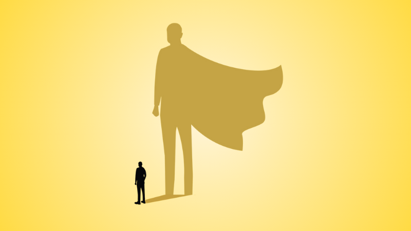 person whose shadow silhouette is a superhero