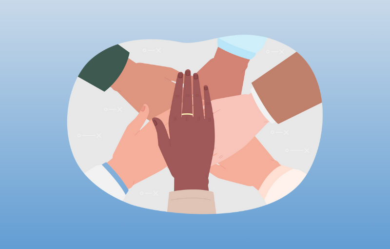 hands in a pile signifying team trust