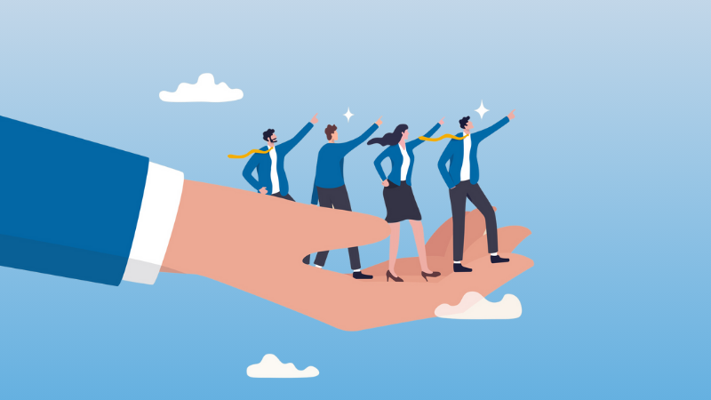 boss' hand holding 4 aspiring employees to represent guiding/helping them