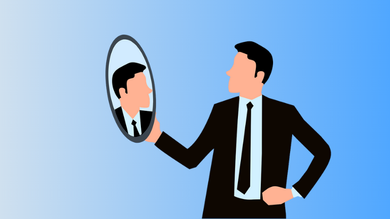 Man looking into a mirror