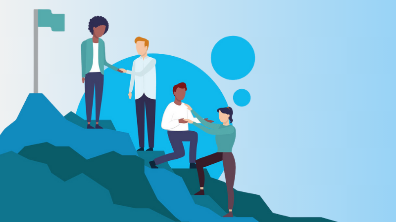 4 employees helping each other climb a mountain