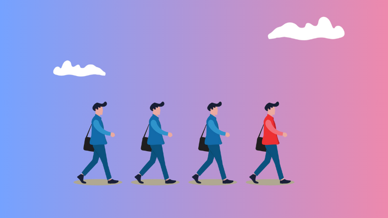 3 blue shirt men following 1 red shirt man