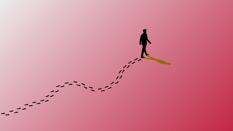 man walking with footprints behind him