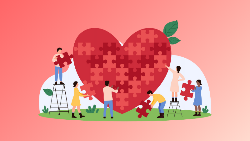 people building a puzzle in the shape of a heart