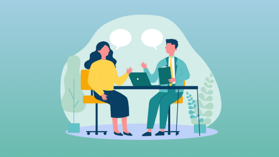 two professionals having a seated coachign conversation