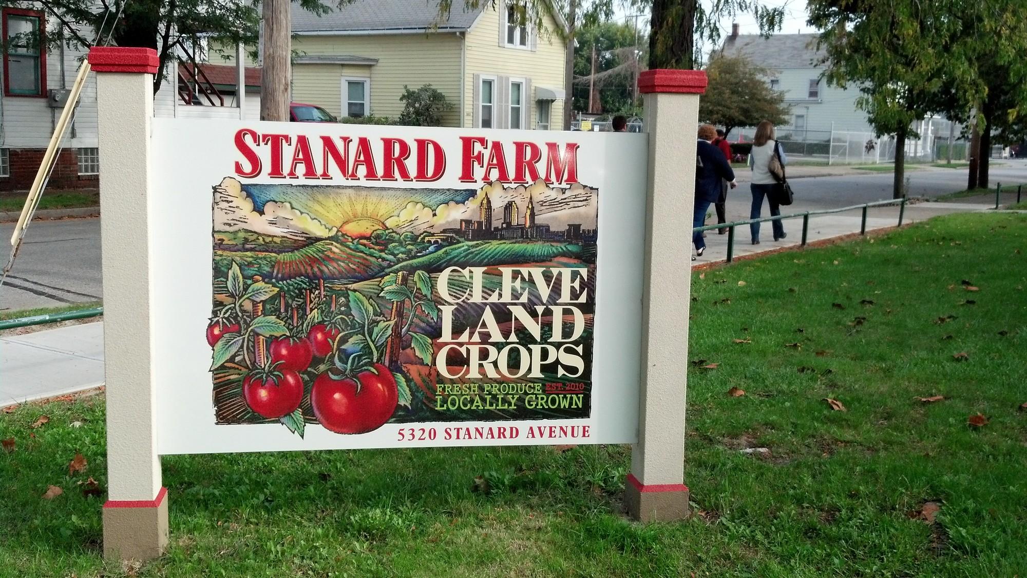 A sign in front of Standard Farms