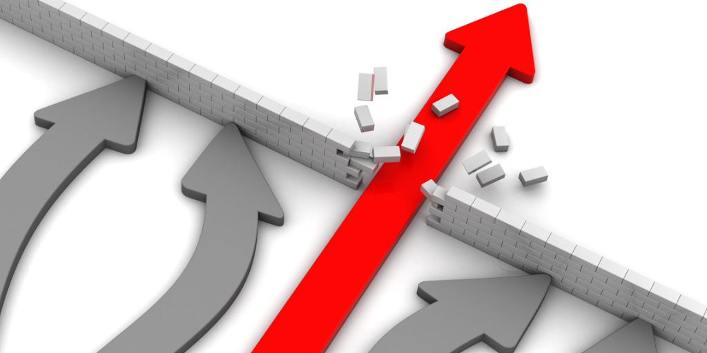 Grey wall with grey arrows trying to break through, while red arrow does