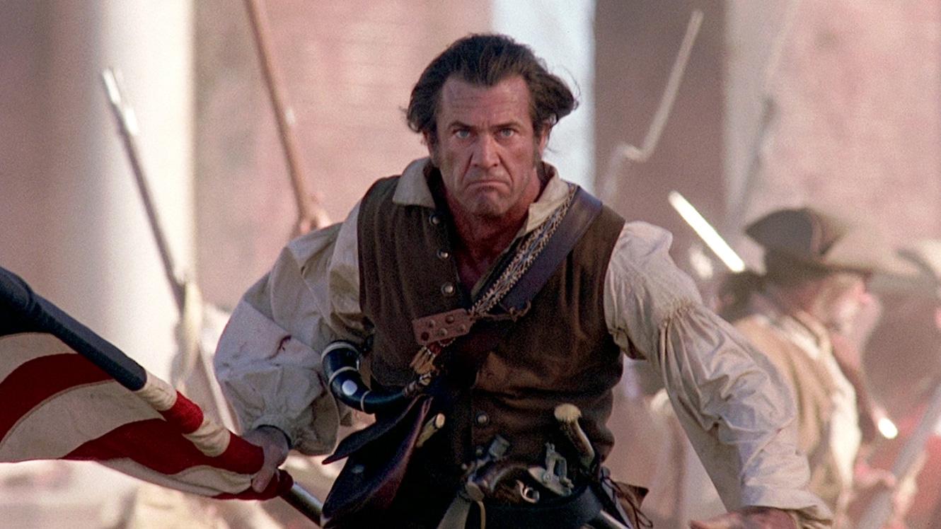 Benjamin Martin carrying American flag, played by Mel Gibson in the movie "The Patriot"