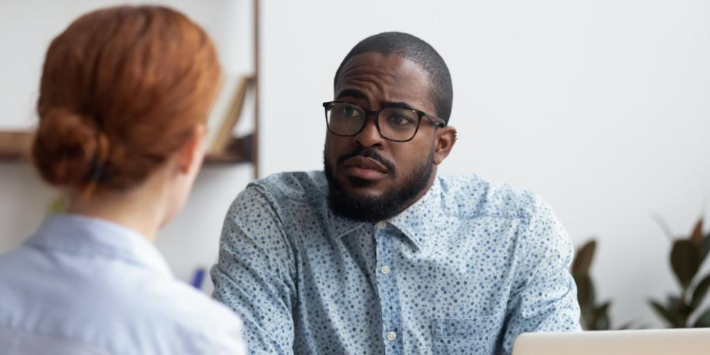 One boss listening his employee's words with serious face