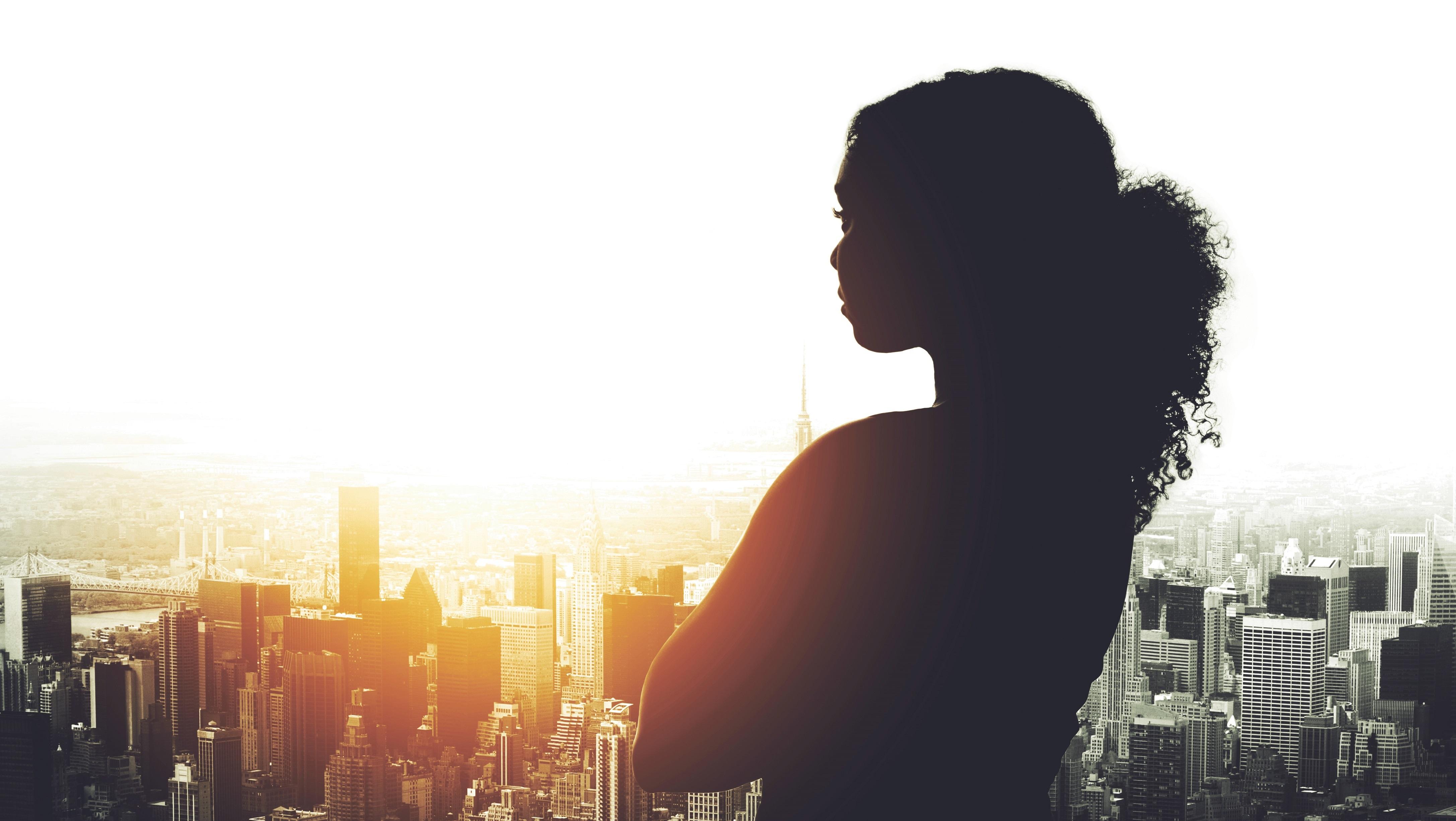 A figure peering toward the sunrise